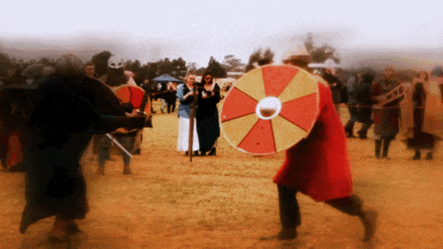 Huscarls fighters engaged in live steel combat at a re-enactment event